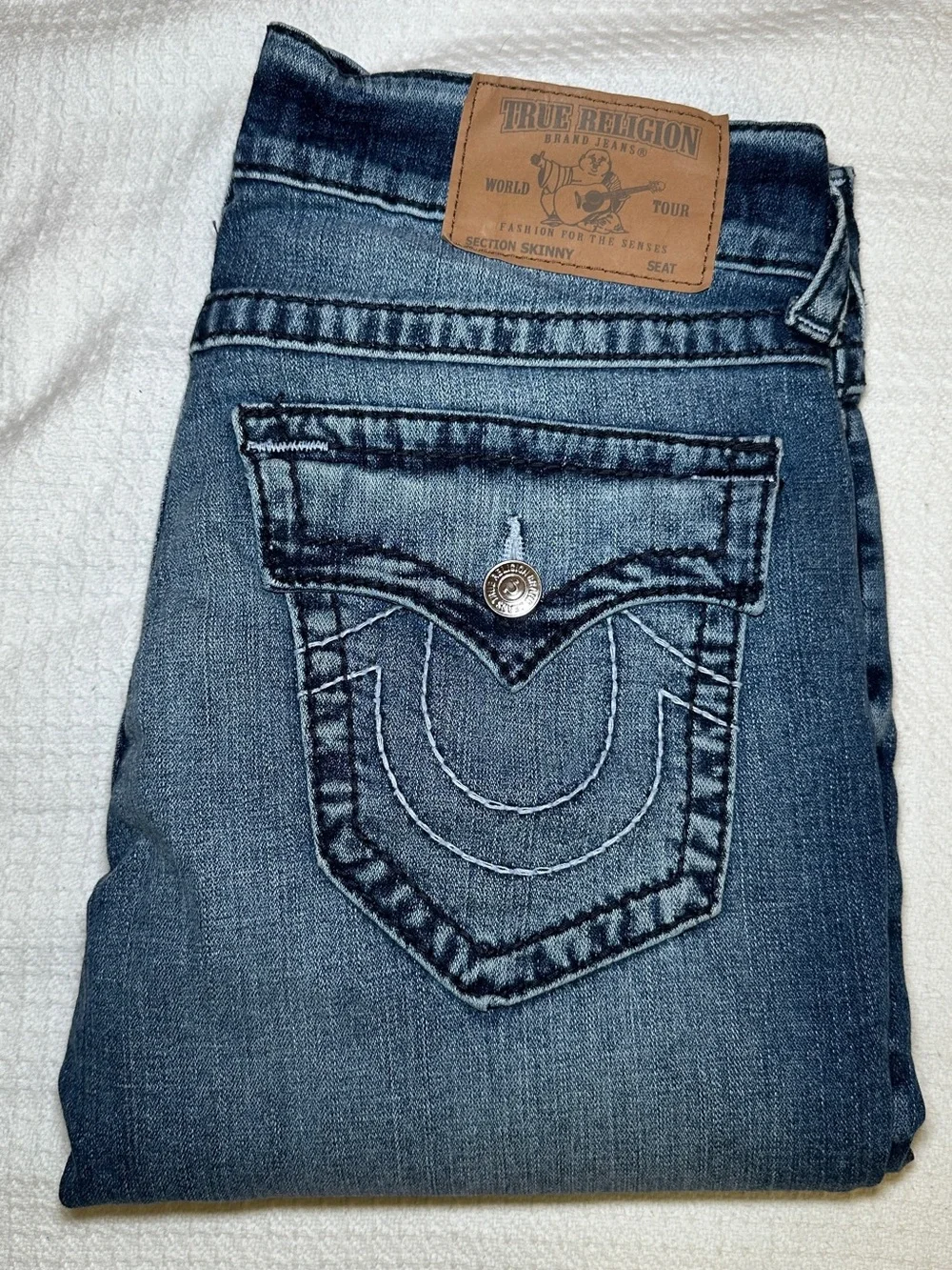 True Religion Men’s Skinny Jeans in Medium Blue Wash with Brown Leather Patch